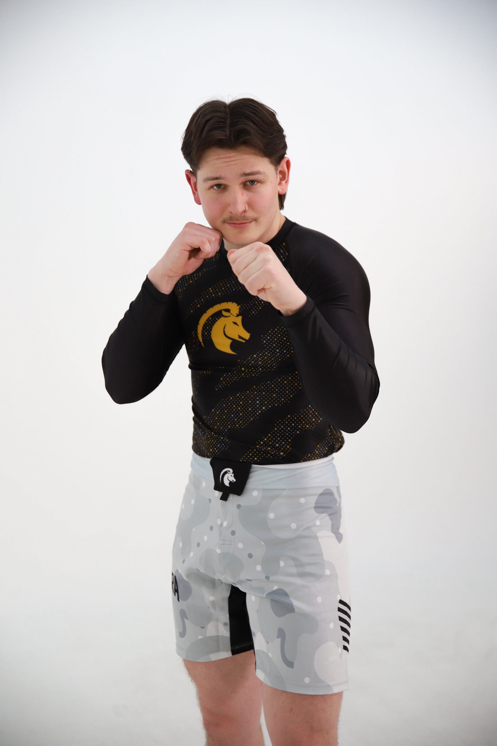 Capra Core gouden rashguard lange mouw detail